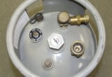 Propane Forklift Cylinder Fittings Fittings and valves on an industrial propane forklift cylinder